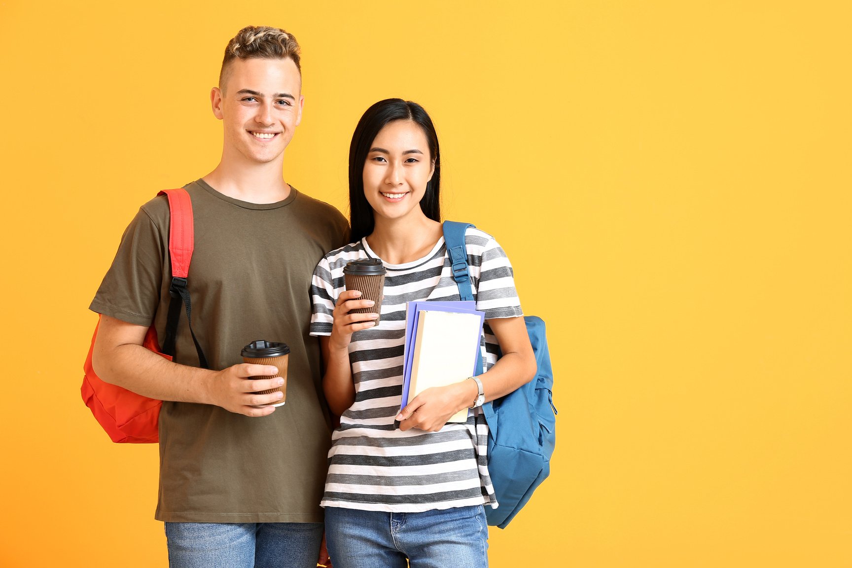 Portrait of Female and Male Students on Yellow Background